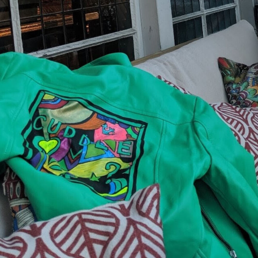 Cuddle, hand-painted green leather jacket by Antoinette Jordaine