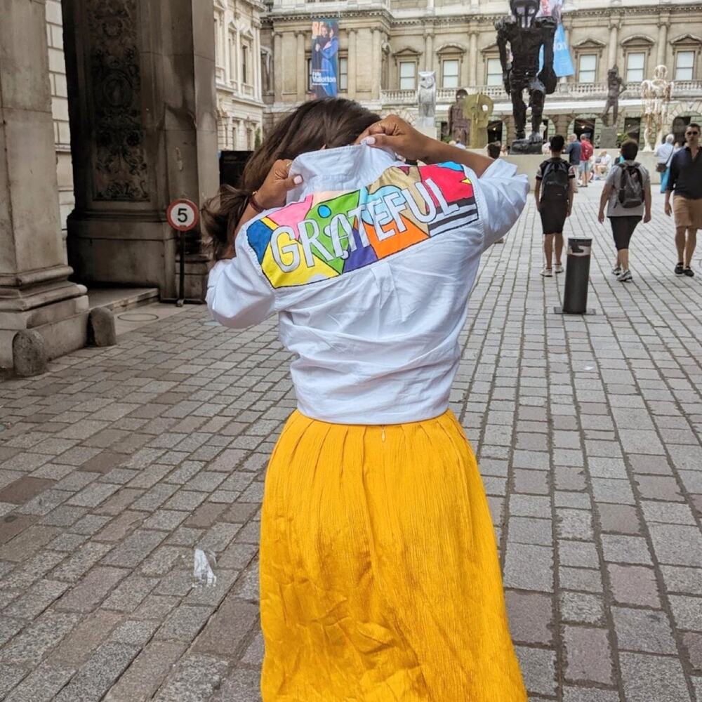 Grateful, hand-painted jacket by Antoinette Jordaine, worn at the Royal Academy