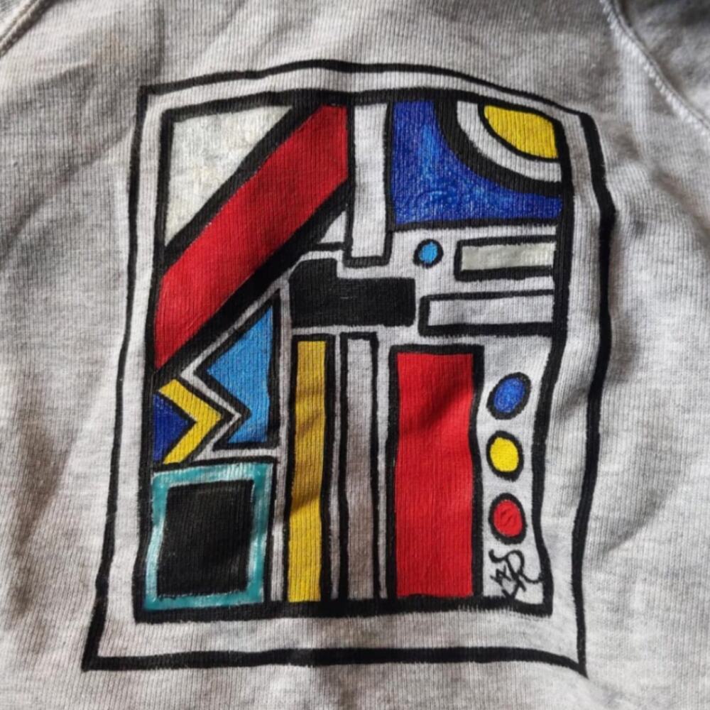 Op-art hand-painted sweatshirt by Antoinette Jordaine